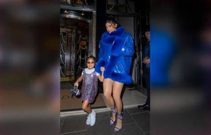 Futuristic: Kylie carried a matching duster coat in the same design, with the item featuring pink and red fringed detailing along the back